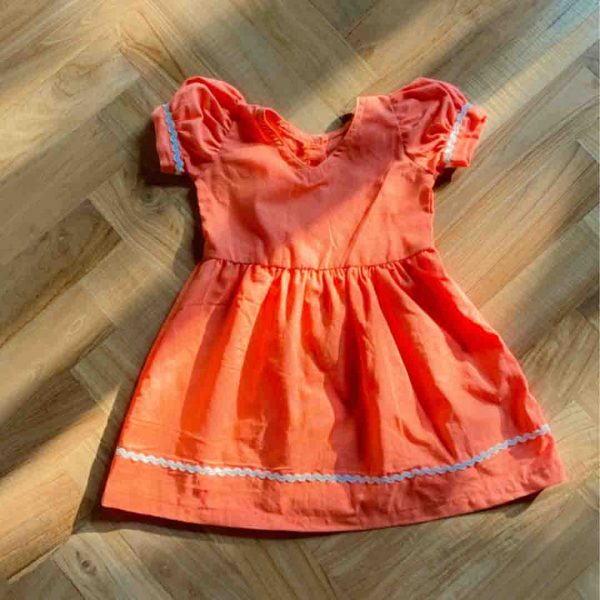Elevate your baby's style game with our irresistible orange v neck dress!